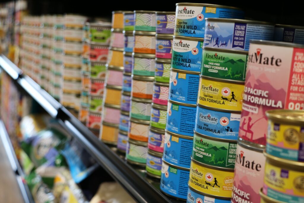 Shelves of canned cat food at The Paw Shop in Cranbrook