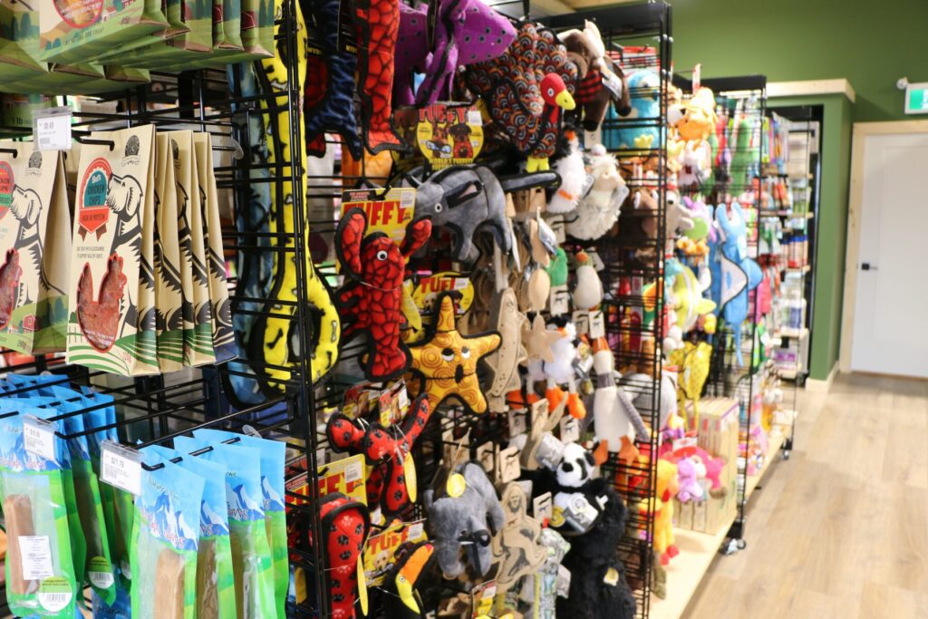 A wall of dog toys at The Paw Shop in downtown Cranbrook